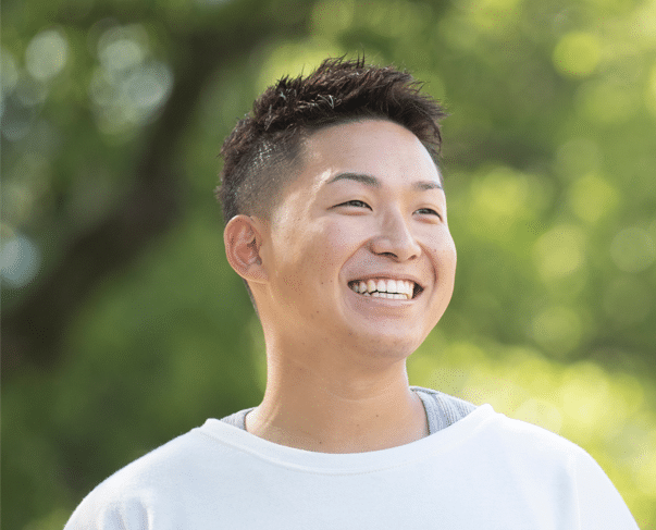 Young Japanese male smiling